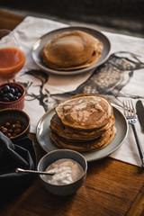 Pancakes with toppings on a table