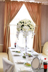 luxury wedding decorations with bench, candle and flowers composition on ceremony place