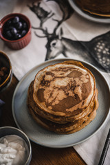 Pancakes with toppings on a table