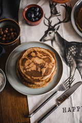 Pancakes with toppings on a table