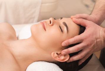 Fototapeta na wymiar Head massage antistress. Relieve fatigue and relieve headaches using oriental massage. Woman at spa