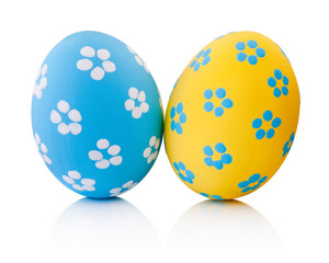 Two colorful handmade Easter eggs isolated on white background