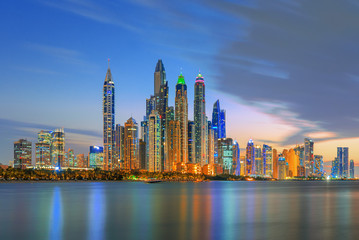 Obraz na płótnie Canvas Dubai Marina, city of tourism from Palm Island at sunrise, United Arab Emirates