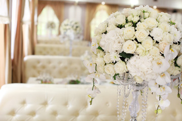 luxury wedding decorations with bench, candle and flowers composition on ceremony place