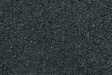 Black Synthetic fabric texture, background. Black fabric. Black background. Corrugated, groove fabric.