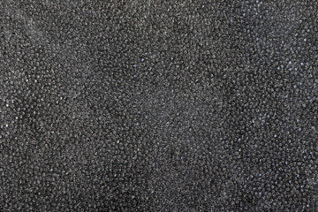 Black leather of wild animal, texture . Leather background, brown color. Close up. Black leather texture
