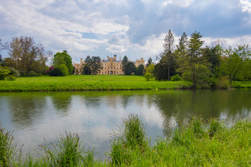Fototapeta na wymiar View of Lednice castle with beautiful park and garden in spring, Neo-gothic palace in South Moravia,Czech Republic