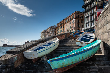 Fototapeta na wymiar Boats on the stairs in Naples