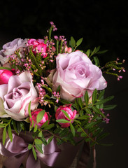 Nice closeup bouquet with pink roses , vertical photo. Useful for greeting cards, social media and print design. Place for text