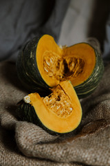 delica pumpkin in the garden. Kabocha, is Japanese pumpkin slice or green pumpkin on Grey background