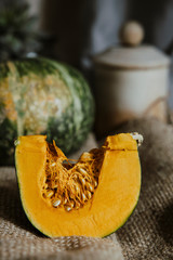 delica pumpkin in the garden. Kabocha, is Japanese pumpkin slice or green pumpkin on Grey background