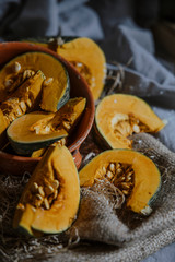 delica pumpkin in the garden. Kabocha, is Japanese pumpkin slice or green pumpkin on Grey background