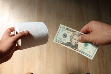 Concept of scarcity of toilet paper and its increase in price due to panic buyers in the...
