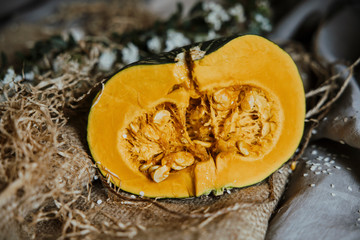 delica pumpkin in the garden. Kabocha, is Japanese pumpkin slice or green pumpkin on Grey background