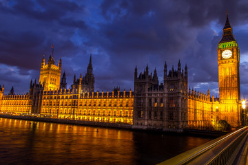 Fototapeta na wymiar The Big Ben, the Parliament the Westminster bridge at night, London, England