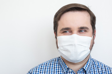 Man in protective mask against infectious diseases isolated on white background, health care concept. Coronavirus quarantine.