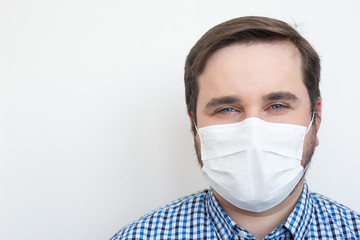 Man in protective face mask isolated on white background, copyspace, copyplace, space for text. Coronavirus, illness, infection, quarantine, medical mask
