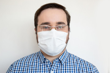 Man wearing hygienic mask to prevent infection, airborne respiratory illness such as flu, 2019-nCoV. Health safety concept COVID-19.