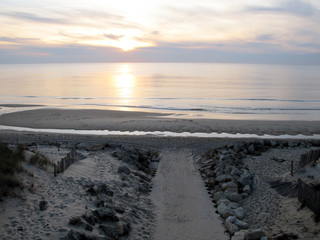wooden pathway access atlantic ocean sunset in Lacanau beach France