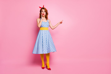 Obraz na płótnie Canvas Full body photo of impressed lady look point index finger incredible discounts scream wow omg suggest pick tips wear blue polka-dot tights isolated over pink color background
