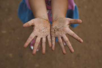Dirty hands of a child. Sand Blurred Hands. Dirty palms.
