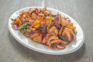 Tumis cumi or stir-fried squid. indonesia food made from squid, garlic, chili and other ingredients. has a savory and spicy taste and has good nutritional content for the body