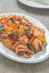Tumis cumi or stir-fried squid. indonesia food made from squid, garlic, chili and other ingredients. has a savory and spicy taste and has good nutritional content for the body