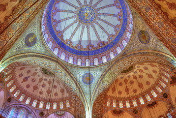 Obraz premium Istanbul, Turkey - Nov 26th 2013: The interior of Blue Mosque (Sultan Ahmed Mosque). HDR effect has been applied.