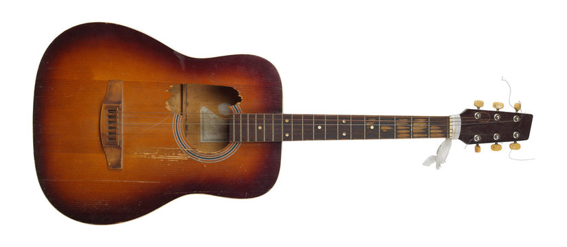 Musical instrument - Front view Broken classic acoustic guitar isolated