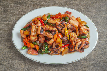 Tumis cumi or stir-fried squid. indonesia food made from squid, garlic, chili and other ingredients. has a savory and spicy taste and has good nutritional content for the body