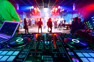 Fototapeta na wymiar professional DJ music mixer at a party at an electronic concert
