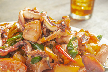 Tumis cumi or stir-fried squid. indonesia food made from squid, garlic, chili and other ingredients. has a savory and spicy taste and has good nutritional content for the body