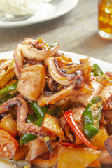 Tumis cumi or stir-fried squid. indonesia food made from squid, garlic, chili and other ingredients. has a savory and spicy taste and has good nutritional content for the body
