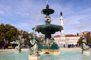 Fototapeta na wymiar View of the King Pedro IV Square (popularly known as Rossio) in Lisbon, Portugal. It is located in the Baixa Pombalina (Pombaline Downtown).