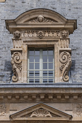 Obraz premium Architectural fragments of Old French house. Saint-Antoine Street, Paris, France.