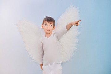 Angel boy in white with wings