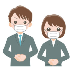 マスクを付けたスーツ姿の男女 
