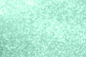 Christmas festive abstract background toned in neon mint color, soft focus.