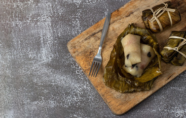 Sticky rice and banana wrap banana leaf bundle rope and Boil in boiling water( KhaoTomMat)