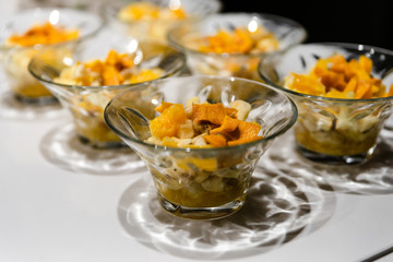 fresh fruit dessert jam poured on a white table,many desserts for the buffet,healthy vegetarian dessert with healthy fruits,fruit dessert for a healthy diet