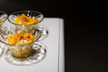fresh fruit dessert jam poured on a white table,many desserts for the buffet,healthy vegetarian dessert with healthy fruits,fruit dessert for a healthy diet