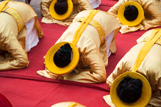 Asian civilian artists performing spiritual activities to express the respect to Buddhist and ancestor within a festival to welcome lunar new year 