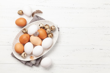 White, brown and quail eggs