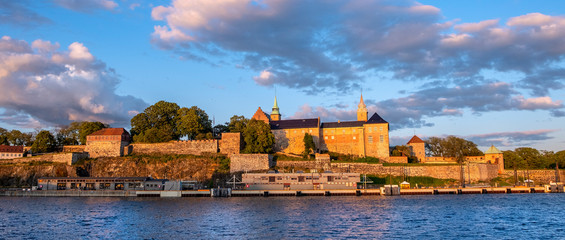 Oslo, Norway - Sunset view of medieval Akershus Fortress - Akershus Festning - historic royal residence at Oslofjorden sea shore