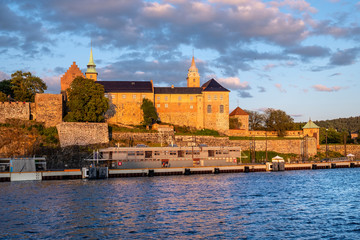 Fototapeta premium Oslo, Norway - Sunset view of medieval Akershus Fortress - Akershus Festning - historic royal residence at Oslofjorden sea shore