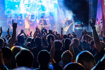 Poster Fans at live rock music concert cheering © Anton Gvozdikov