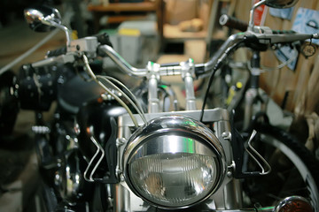 Fototapeta na wymiar motorcycle headlight detail / vintage motorcycle, antique headlight light, brutal transport romance