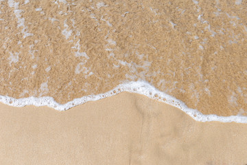 Clear water wave on fine sand beach, nature background concept, outdoor day ligth