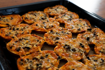 homemade hot sandwiches cooked with hands with different fillings lie in a protvin,quick sandwiches at home,fast food at home,vegetarian and meat sandwiches on one tray