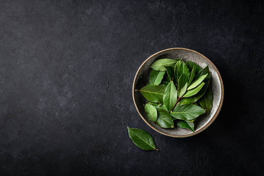 Bay Leaves On A Black Background, Top View, Place For Text.